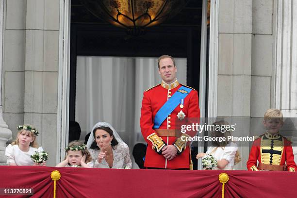 Prince William, Duke of Cambridge and Catherine, Duchess of Cambridge greet wellwishers from the balcony next to Lady Louise Windsor, Grace Van...