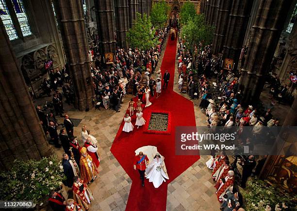 Prince William, Duke of Cambridge and Catherine, Duchess of Cambridge leave the Westminster Abbey after their wedding ceremony on April 29, 2011 in...
