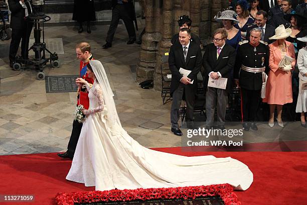 Prince William, Duke of Cambridge and Catherine, Duchess of Cambridge leave Westminster Abbey following their marriage ceremony, on April 29, 2011 in...