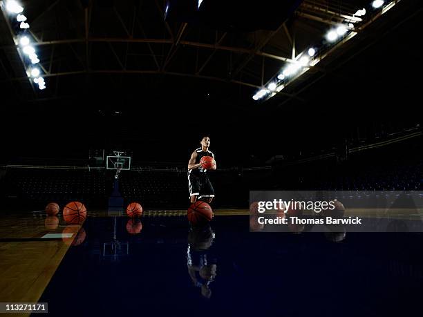 basketball player practicing free throws in arena - practice stock pictures, royalty-free photos & images