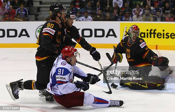 Constantin Braun of Germany tackles Vladimir Tarasenko of Russia during the IIHF World Championship group A match between Germany and Russia at...