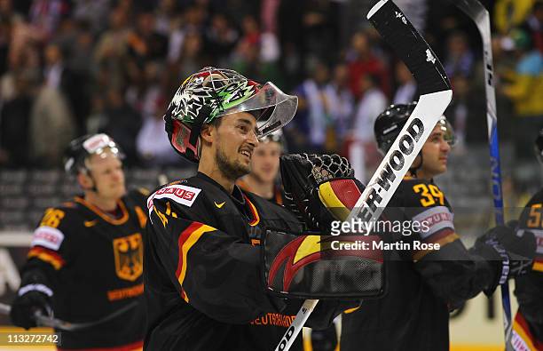 Dennis Endras, goaltender of Germany celebrate after the IIHF World Championship group A match between Germany and Russia at Orange Arena on April...