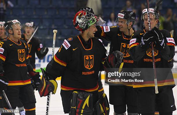 Dennis Endras , goaltender of Germany celebrates with his team mates after the IIHF World Championship group A match between Germany and Russia at...