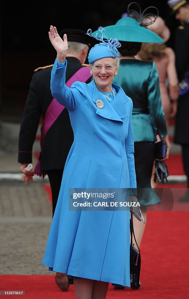 The Queen Margrethe of Denmark waves as