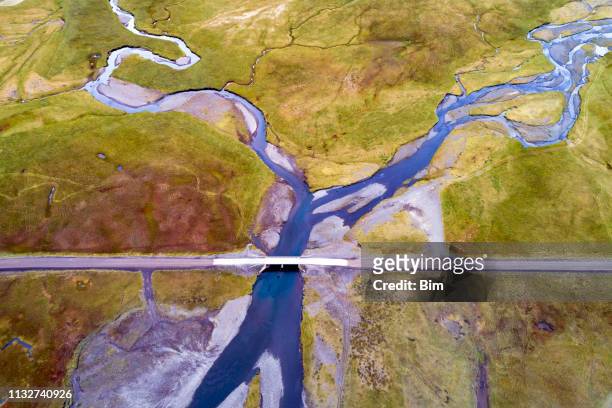 aerial view of bridge over braided river in iceland - snaefellsnes imagens e fotografias de stock