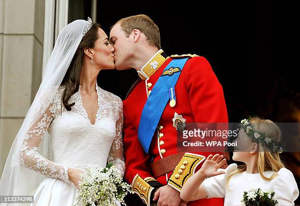 Prince William, Duke of Cambridge and Catherine, Duchess of Cambridge kiss on the balcony of Buckingham Palace after getting married on April 29,...