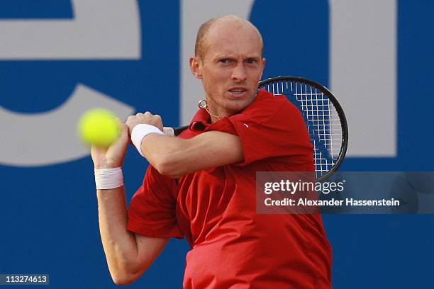 Nikolay Davydenko of Russia plays a back hand during his quarterfinal match against Marin Cilic of Croatia at BMW Open at the Iphitos tennis club on...