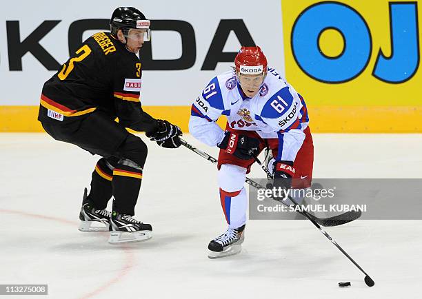 Germany's Justin Krueger and Russia's Maxim Afinogenov vie during the IIHF Ice Hockey World Championship group A match Germany vs Russia in...