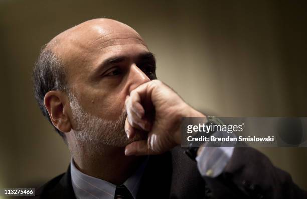Federal Reserve Chairman Ben Bernanke waits to speak during a luncheon at the 7th Federal Reserve Community Affairs Research Conference April 29,...