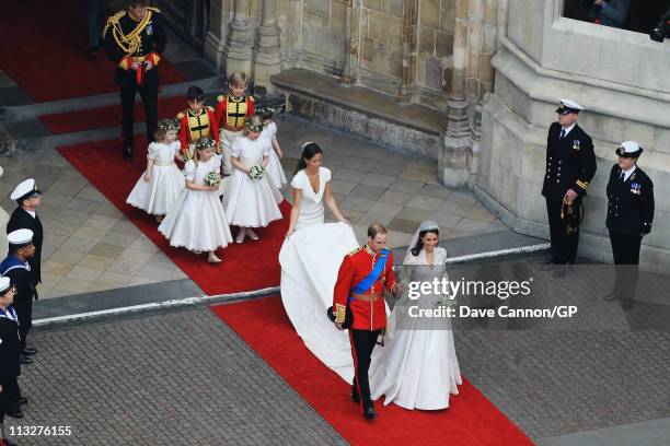 Their Royal Highnesses Prince William, Duke of Cambridge and Catherine, Duchess of Cambridge are followed by Maid of Honour Pippa Middleton, their...