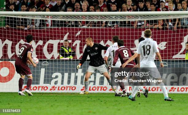 Christian Tiffert of Kaiserslautern scores his teams first goal during the Bundesliga match between 1.FC Kaiserslautern and FC St.Pauli at...