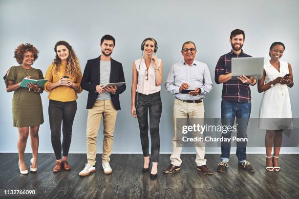 you might be standing still but the digital world is not - people standing in a row stock pictures, royalty-free photos & images