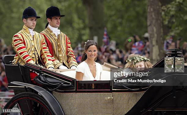 Pippa Middleton and Grace Van Cutsem travel down The Mall on route to Buckingham Palace in a horse drawn carriage following Prince William, Duke of...