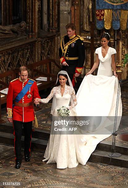 Britain's Prince William and his wife Kate, Duchess of Cambridge, make their way out of Westminster Abbey in London, followed by Maid of Honour...