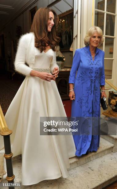 Catherine, Duchess of Cambridge and Camilla, Duchess of Cornwall leave Clarence House to travel to Buckingham Palace for the evening celebrations...