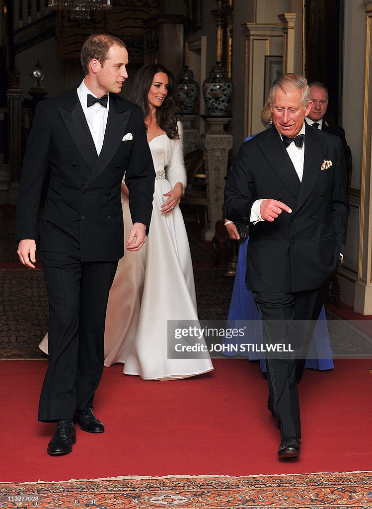 Britain's Prince Charles (R) walks with