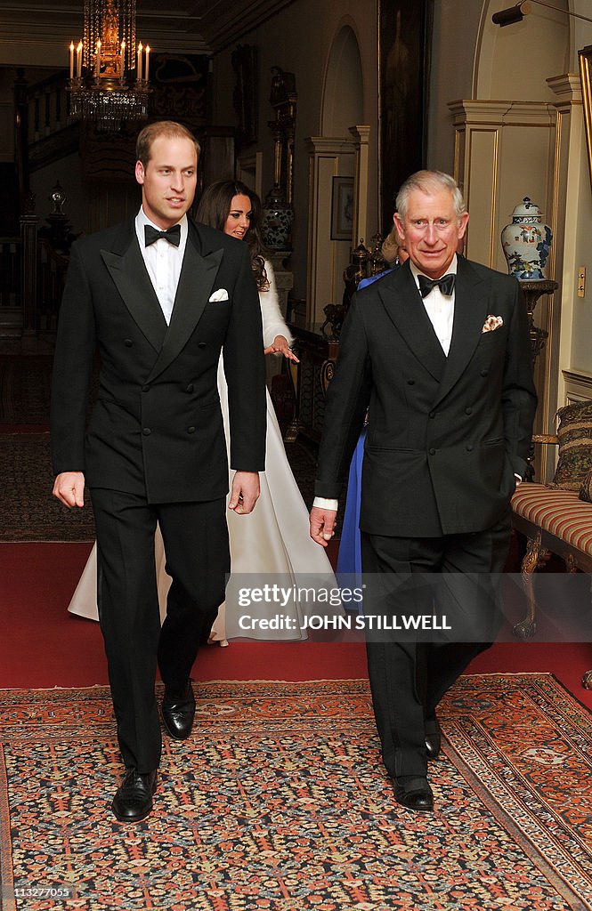 Britain's Prince Charles (R) walks with