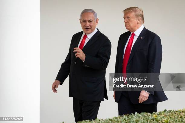 Prime Minister of Israel Benjamin Netanyahu and U.S. President Donald Trump walk through the colonnade prior to an Oval Office meeting at the White...
