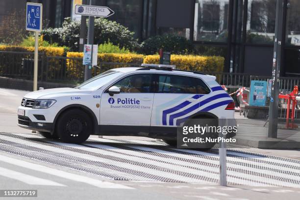 Police Car Vehicles around the blocked Rue de la Loi street, Rond-point Robert Schuman and Le Barlaymnt and Justus Lipsius buildings, in the streets...