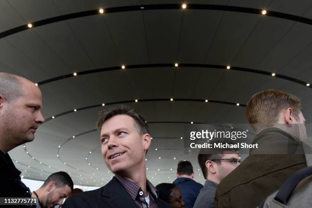 Attendees gather before an Apple product launch event at the Steve Jobs Theater at Apple Park on March 25, 2019 in Cupertino, California. Apple Inc....