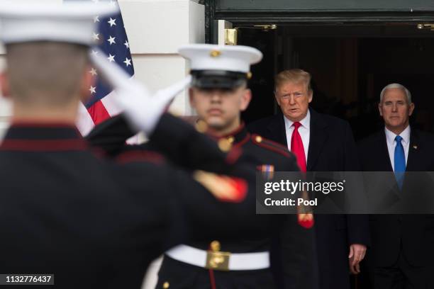 President Donald J. Trump and US Vice President Mike Pence walk out of the South Portico of the White House behind US Marines to greet Prime Minister...