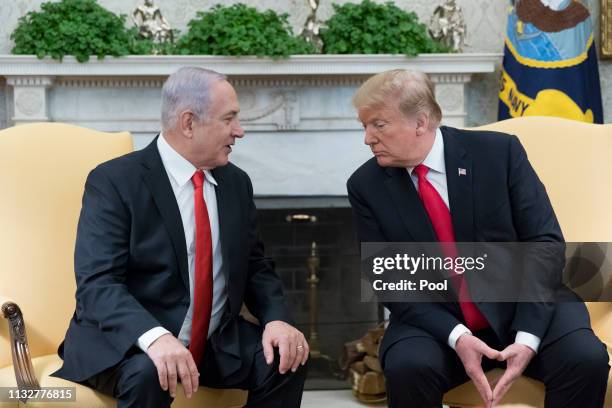 Prime Minister of Israel Benjamin Netanyahu speaks beside US President Donald J. Trump during their meeting in the Oval Office of the White House...