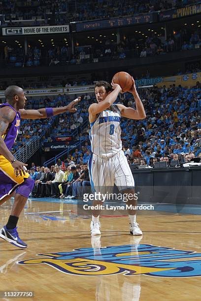 Marco Belinelli of the New Orleans Hornets looks to pass the ball against the Los Angeles Lakers during Game Six of the Western Conference...