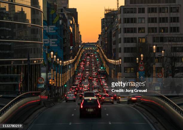 rue de la loi at dusk - traffic stock pictures, royalty-free photos & images