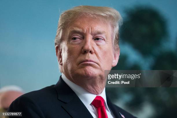 President Donald J. Trump listens to remarks from Prime Minister of Israel Benjamin Netanyahu , before signing an order recognizing Golan Heights as...