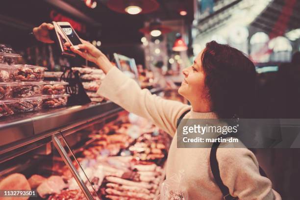woman in valencia shopping at the farmer's market - cultivated meat stock pictures, royalty-free photos & images