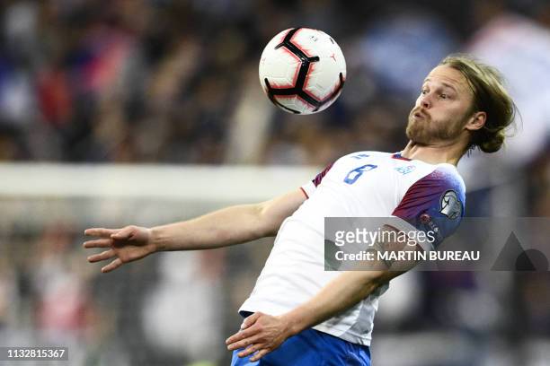 Iceland's midfielder Birkir Bjarnason eyes the ball during the UEFA Euro 2020 Group H qualification football match between France and Iceland at the...