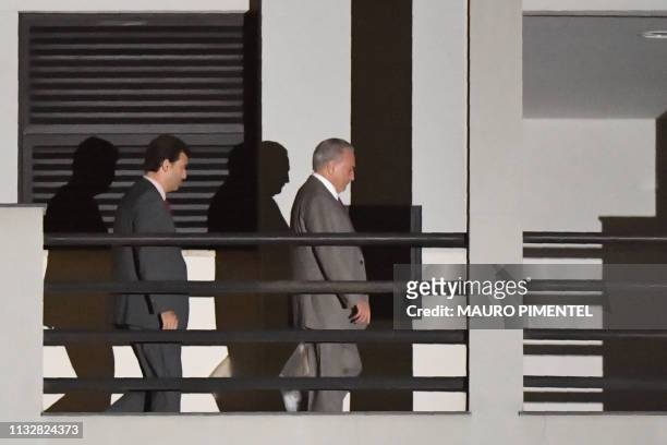 Brazil's former president Michel Temer leaves the Federal Police headquarters in Rio de Janeiro, Brazil, on March 25 after a Brazilian judge ordered...