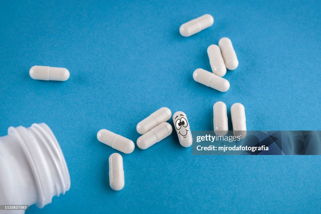 Pills spill out of pill bottle