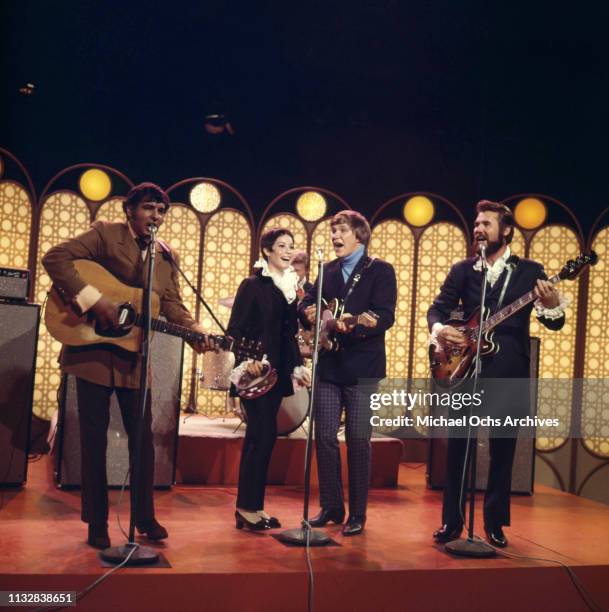 Kenny Rogers, Thelma Camacho, Mike Settle and Terry Williams of the band "Kenny Rogers & The First Edition" perform on a TV show in 1967..