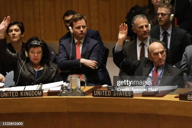 The U.S. Envoy on Venezuela, Elliott Abrams, and UK ambassador to the United Nations Karen Pierce vote at the United Nations Security Council in...