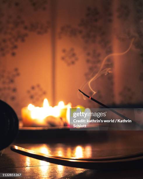 close up of an incense stick - feuer stock pictures, royalty-free photos & images