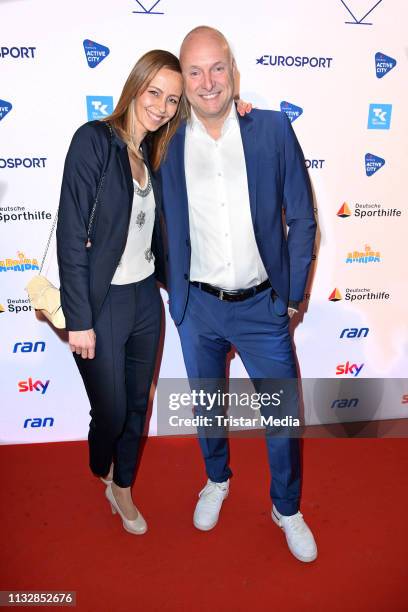 Frank Buschmann and his girlfriend Lisa Heckl attend the German Sports Journalism Award at Hotel Grand Elysee on March 25, 2019 in Hamburg, Germany.