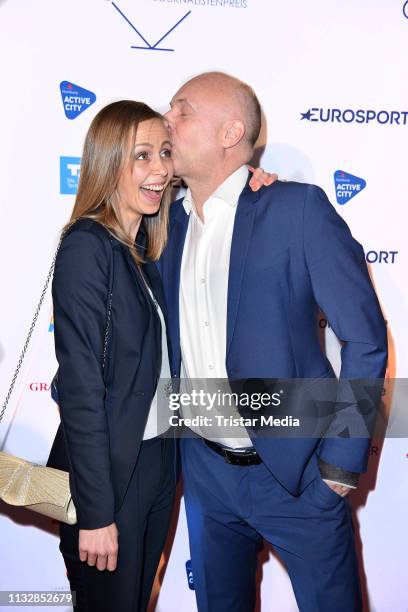 Frank Buschmann and his girlfriend Lisa Heckl attend the German Sports Journalism Award at Hotel Grand Elysee on March 25, 2019 in Hamburg, Germany.