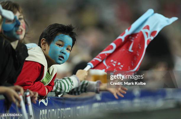 Young Waratahs supporter watches on in the crowd during the round 11 Super Rugby match between the Waratahs and the Rebels at the Sydney Football...