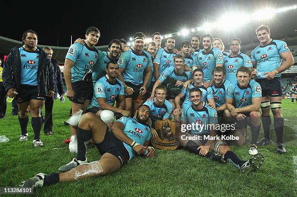 The Waratahs team pose with the Weary Dunlop Shield after winning the round 11 Super Rugby match between the Waratahs and the Rebels at the Sydney...