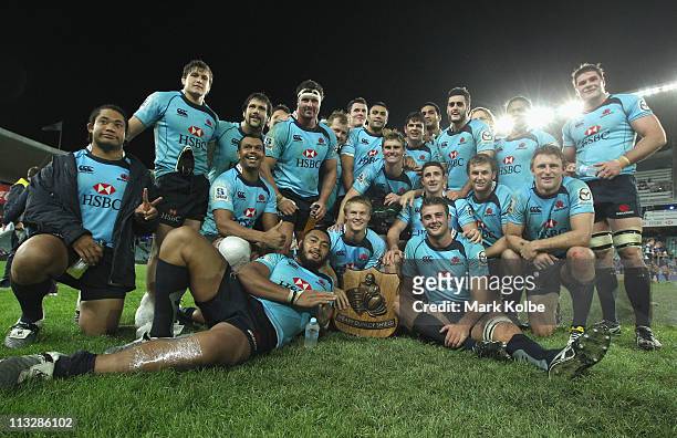 The Waratahs team pose with the Weary Dunlop Shield after winning the round 11 Super Rugby match between the Waratahs and the Rebels at the Sydney...