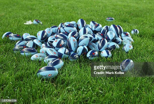 Waratahs mini footballs are seen before being thrown into the crowd by players during the round 11 Super Rugby match between the Waratahs and the...