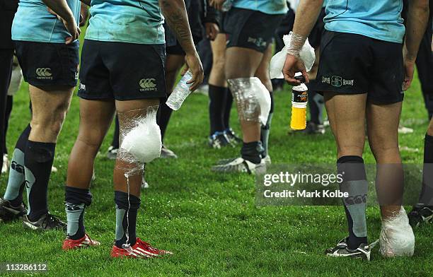 Ice packs are seen on the Waratahs players as they wait for the post-match presentation during the round 11 Super Rugby match between the Waratahs...