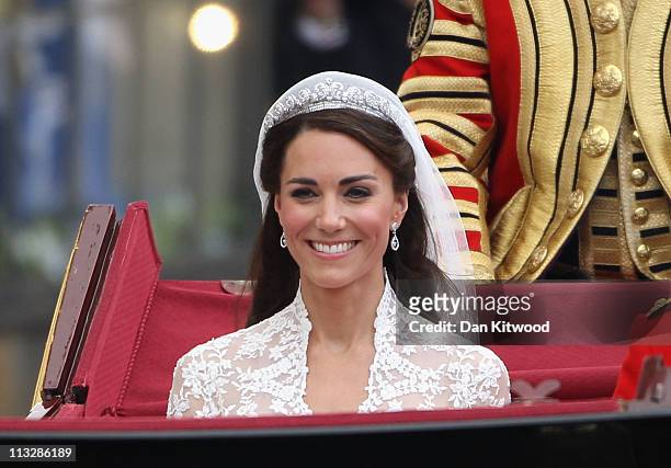 Her Royal Highness Catherine, Duchess of Cambridge journeys by carriage procession to Buckingham Palace following her marriage to Prince William,...