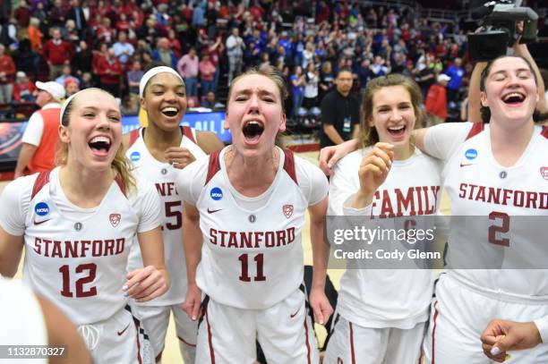 Alanna Smith of the Stanford Cardinal and teammates including, from left, Lexie Hull, Maya Dodson and Shannon Coffee celebrate beating the BYU...