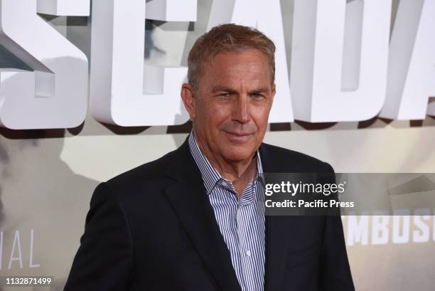 Actor Kevin Costner, 64 years-old, poses for media as he arrives for the premiere of 'Highwaymen' at Capitol cinema in Madrid.