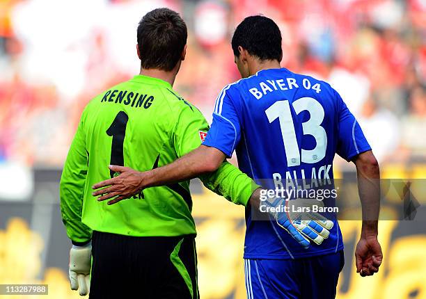 Goalkeeper Michael Rensing of Koeln hughs Michael Ballack of LEverkusen during the Bundesliga match between 1. FC Koeln and Bayer Leverkusen at...