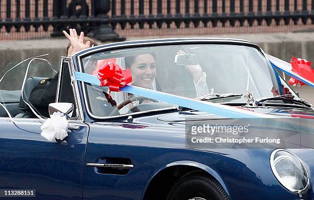 Catherine, Duchess of Cambridge waves to well wishers as she and Prince William, Duke of Cambridge leave Buckingham Palace on April 29, 2011 in...