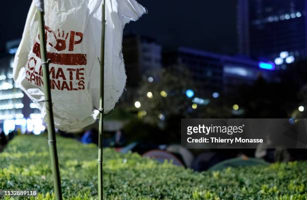 Climate activists form a protest camp near the statue of King Leopold II at Trone square on March 25, 2019 in Brussels, Belgium. The activists want...