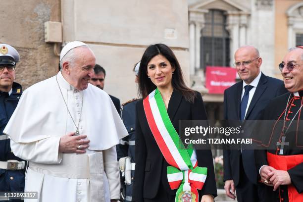 Rome mayor Virginia Raggi and Vicar General of Rome, Italian prelate Angelo De Donatis greet Pope Francis upon his arrival for a visit at Rome's City...